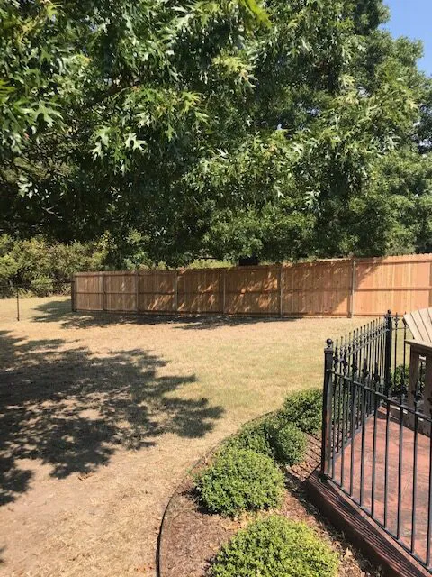 Steel fence and wooden fence installed by Banks Construction