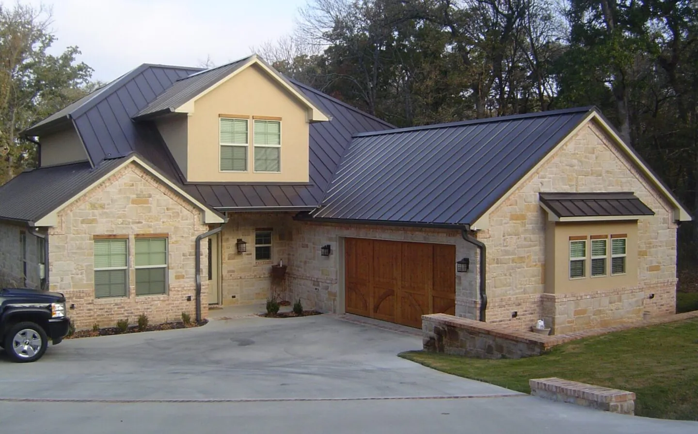 Beautiful home with a metal roof installed by Banks Construction